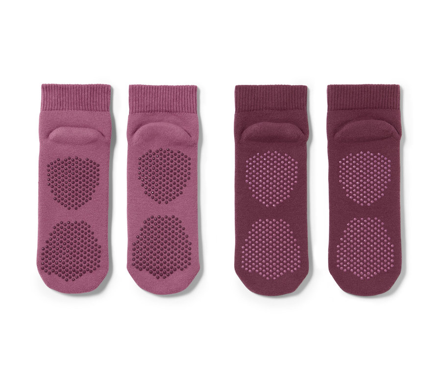 Zwei Paar lila Yogasocken mit Anti-Rutsch-Sohle.