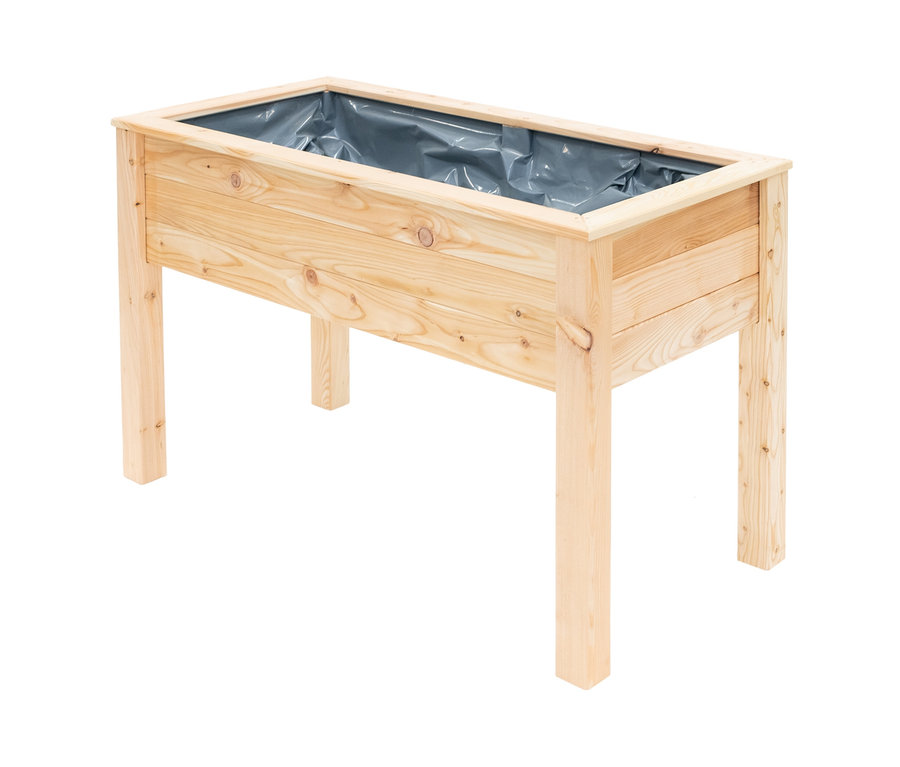 Ein Stelzenhochbeet aus hellem Holz mit grauer Auskleidung.