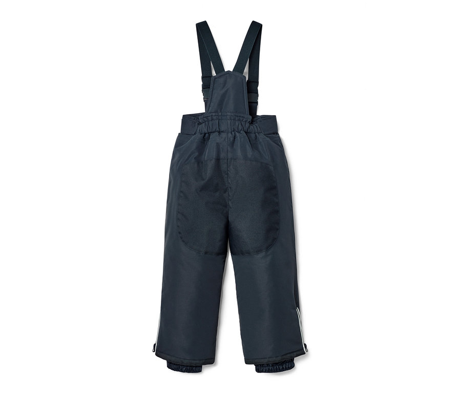 Eine marineblaue Latzhose aus einer 2-teiligen Schneekombi mit Vogel-Alloverprint.