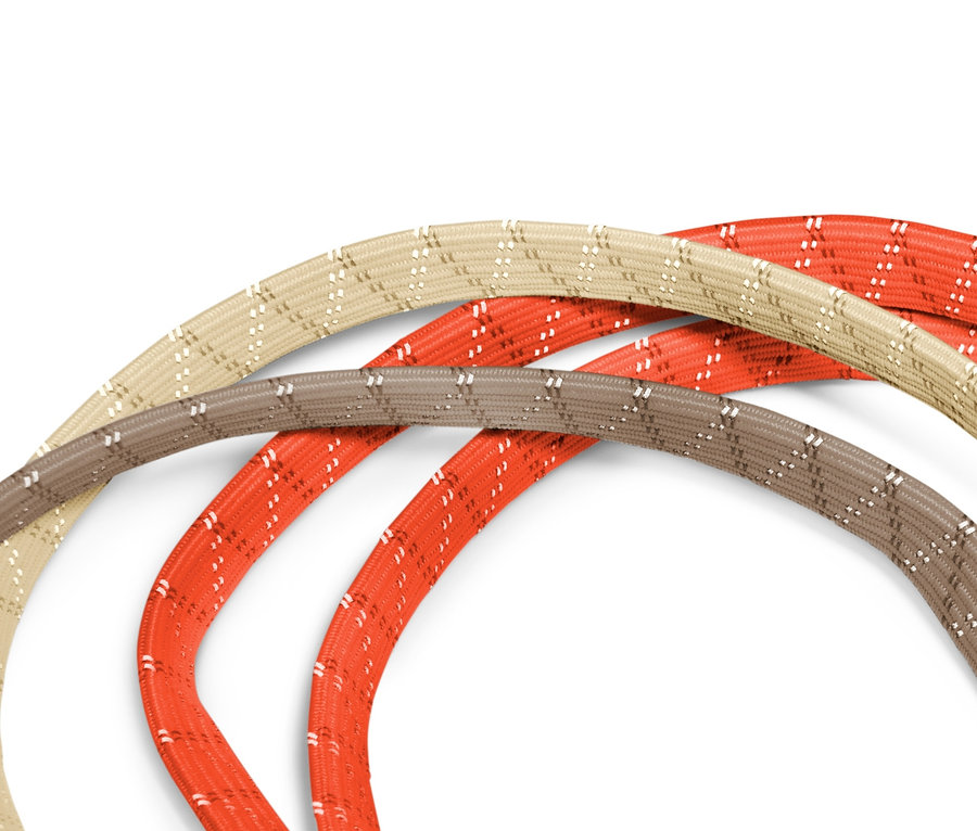 Drei Fahrrad-Spanngurte in Beige, Braun und Orange.