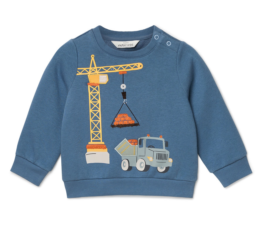 Blauer Pullover mit einer Abbildung eines Krans, der Ziegelsteine hebt, und einem Lastwagen darunter.