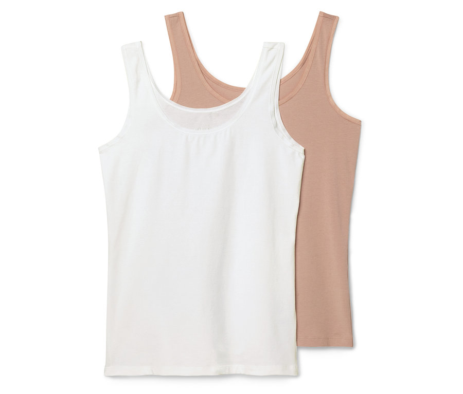 Zwei Tanktops liegen übereinander, eines ist weiß und das andere hellbraun.