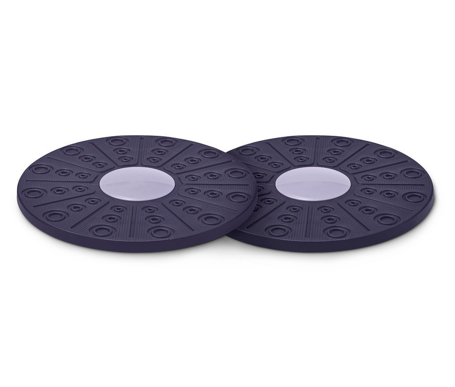 Zwei Balance-Boards liegen nebeneinander. Die Boards sind rund und haben eine violette Farbe.