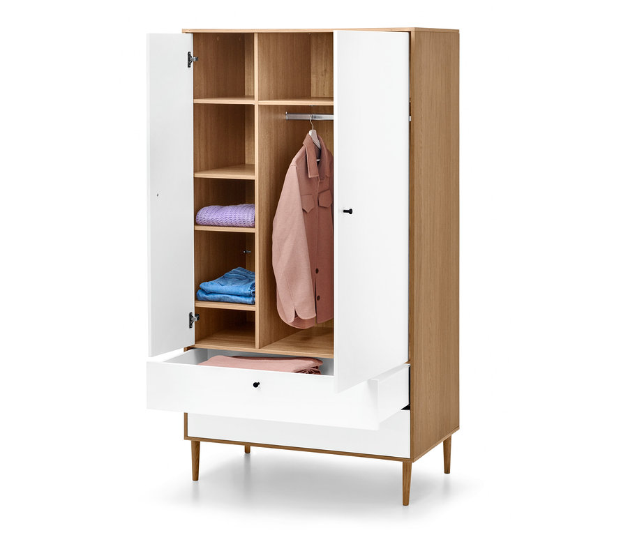 Geöffneter Kleiderschrank »Bekeson« mit Regalen, Schublade und aufgehängter rosa Jacke.