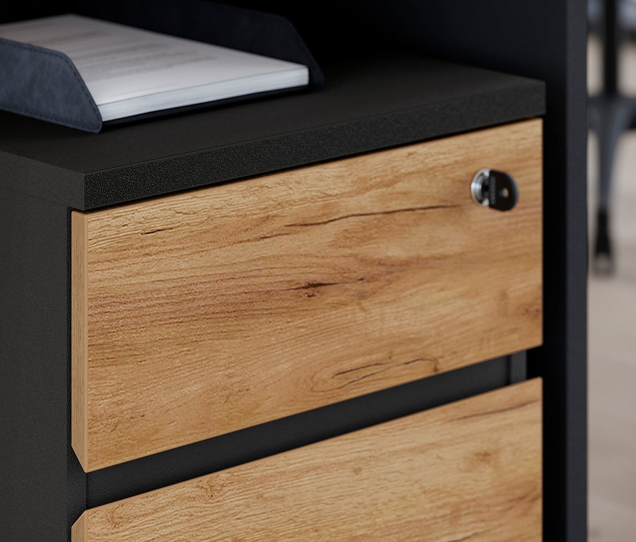 Detailansicht eines Rollcontainers »Lissabon« mit Holzschubladen und schwarzem Rahmen.
