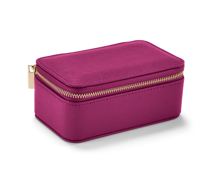 Eine kleine, pinke Schmuckdose mit goldenem Reißverschluss.