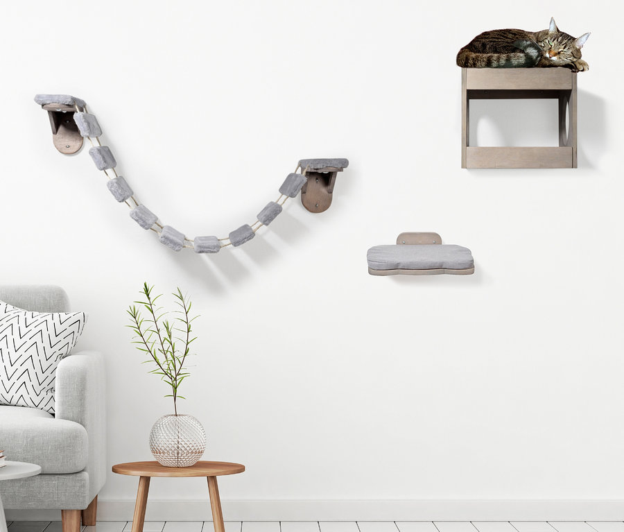 Eine Katze schläft auf einem Möbelstück aus dem Katzenmöbel-Set.