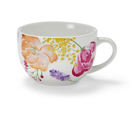 Eine Milchkaffeeschale mit Blumenmuster.