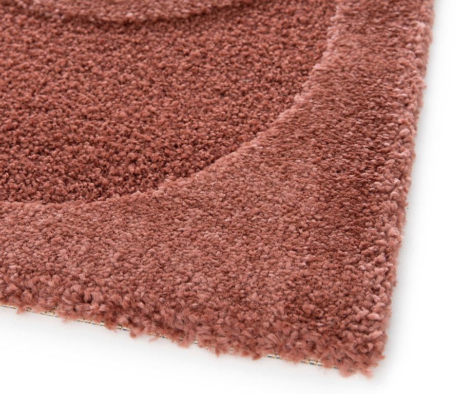 Detailaufnahme eines roten Teppichs »Cosmo«.