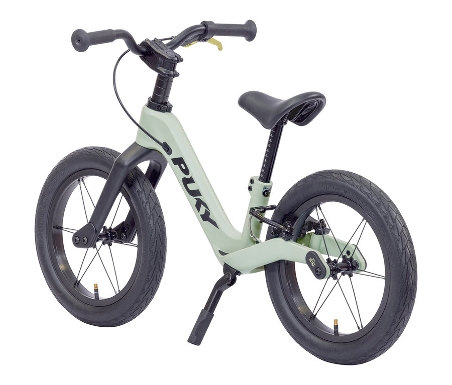 Grünes PUKY Laufrad NEXT BUNDLE 12" und 14" mit schwarzen Reifen.