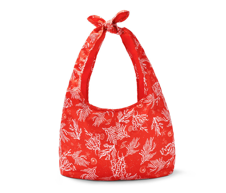 Faltbare Strandtasche mit rotem Korallenmuster.