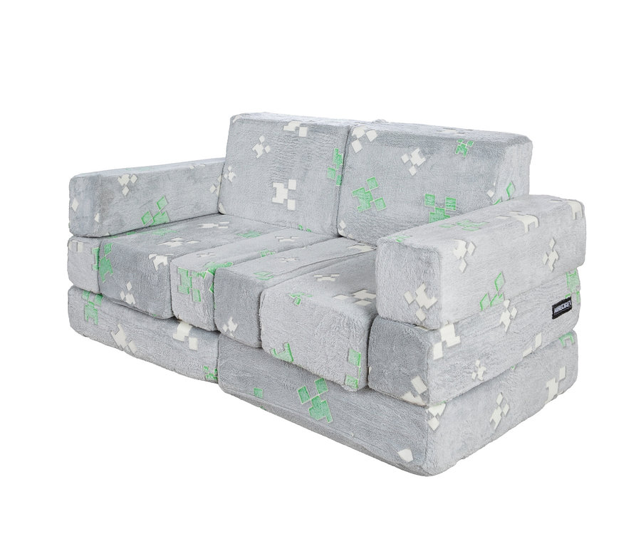 Graues, modulares Sofa aus Plüschstoff mit grünen und weißen Pixelmustern im Minecraft-Design.