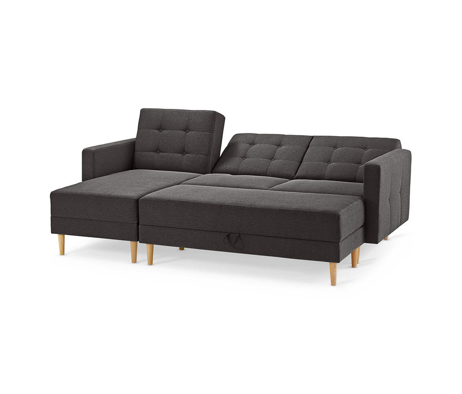 Dunkelgraues Federkern-Eckschlafsofa »Just Relax« mit getufteten Rückenlehnen, integrierter Stauraumbank und hellen Holzfüßen.