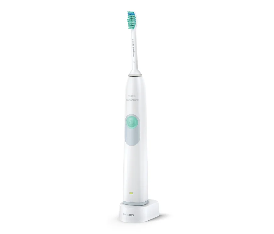 Weiße elektrische Schallzahnbürste Philips HX6221/21 »DailyClean 3100« auf Ladestation.