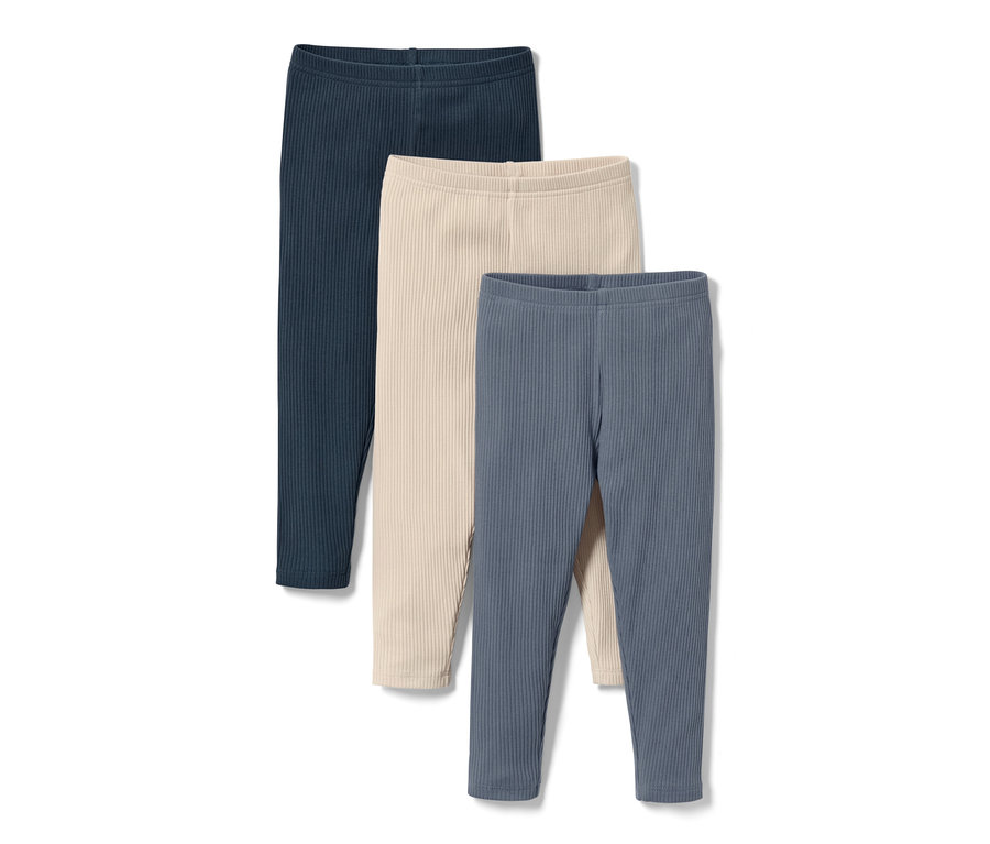 Drei Baby-und-Kleinkinder-Leggings in Dunkelblau, Creme und Blau.