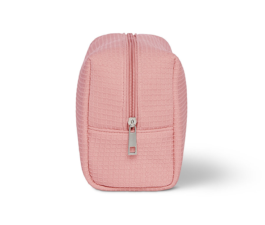 Eine rosa Kulturtasche mit Reissverschluss.