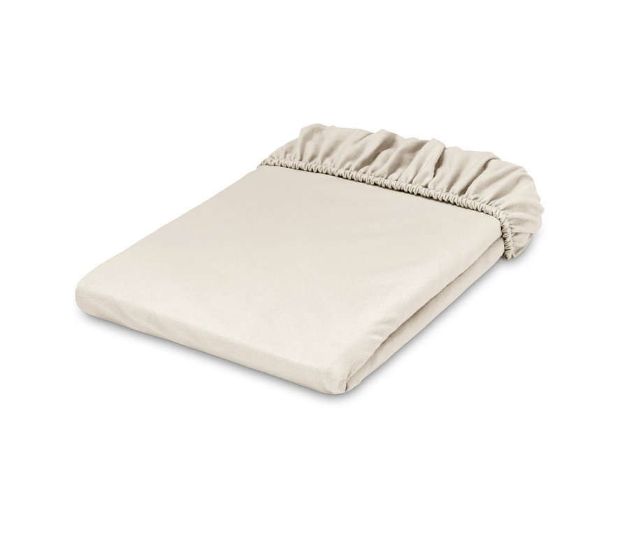 Ein zusammengefaltetes, creme Biber-Spannbettlaken.