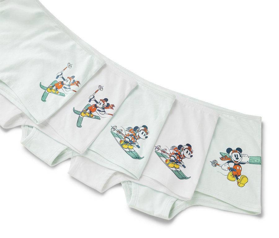 Fünf Mädchen-Pantys »Mickey and Friends« liegen nebeneinander, jede mit einem anderen Mickey-Mouse-Ski-Motiv.
