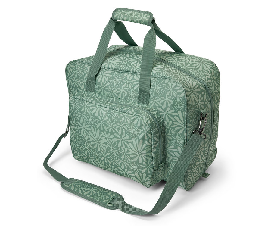 Eine grüne Nähmaschinentasche mit Blumenmuster.