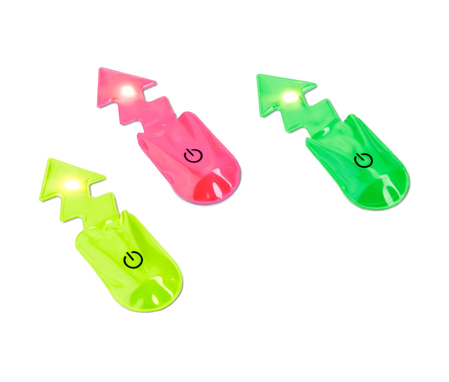 Drei LED-Magnet-Lichter »Blitz« in verschiedenen Farben liegen auf einem weißen Hintergrund.