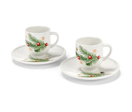 Zwei Espressotassen mit Weihnachtsmotiv auf weißem Hintergrund.