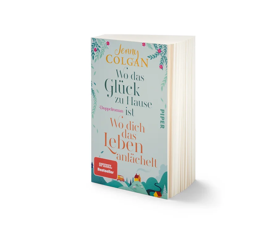 Das Buch Doppelroman »Wo das Glück zuhause ist« und »Wo dich das Leben anlächelt« von Jenny Colgan liegt auf dem Tisch.