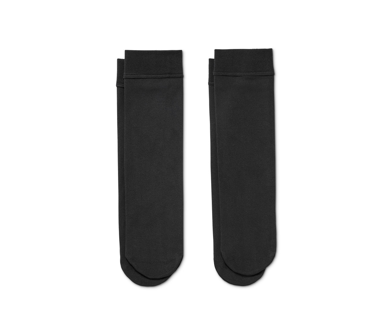 Zwei Paar schwarze Thermokniestrümpfe liegen nebeneinander.