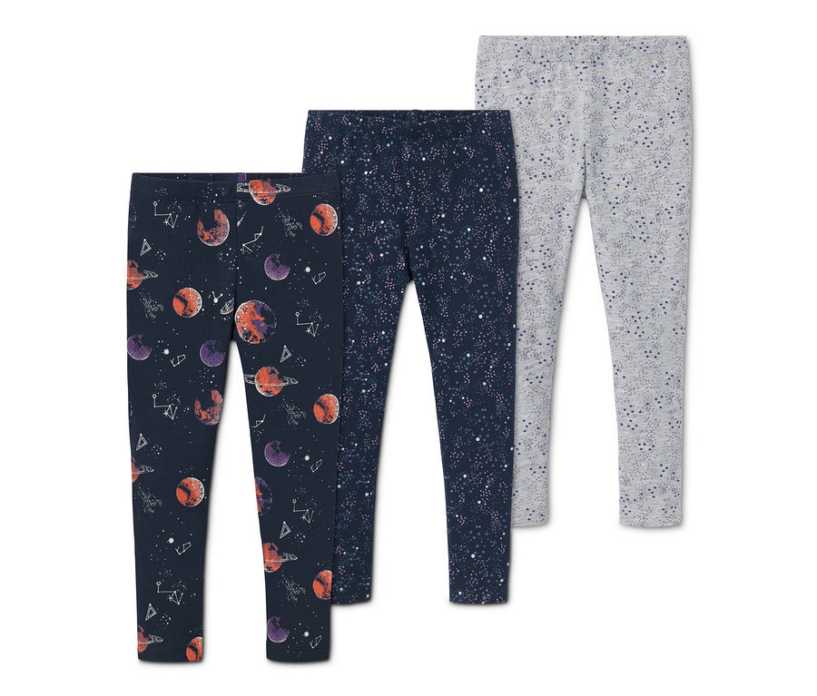 Drei Leggings: eine dunkelblaue mit Planeten, eine dunkelblaue mit Sternen und eine graue mit Muster.