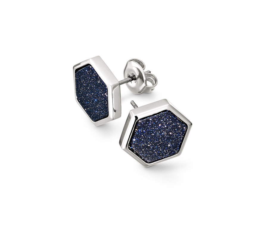 Zwei silberne Ohrstecker Sternenhimmel in Sechseckform mit glitzerndem dunkelblauem Inneren.