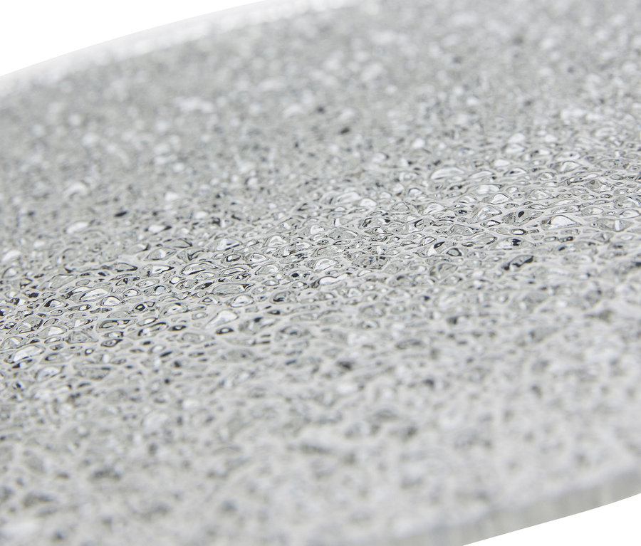 Detailaufnahme des Glasdiffusors der Hübsch Tischleuchte »Disc«.