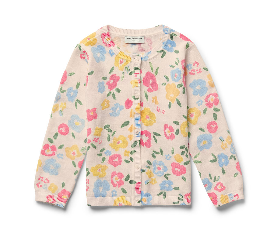 Eine Kinder-Strickjacke mit Blumenmuster auf hellem Hintergrund.