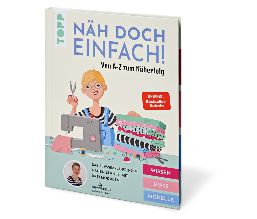 Buch »Näh doch einfach« mit Comic-Zeichnung einer Schneiderin, Nähmaschine und Stoffen.