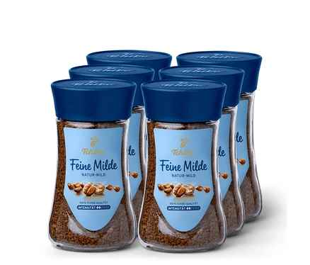 Sechs Gläser Feine Milde Instantkaffee mit blauem Deckel.
