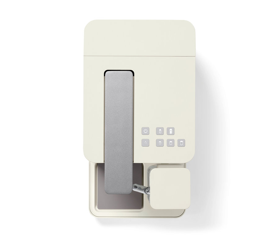 Draufsicht auf eine cremefarbene Qbo MILK MASTER White Cashmere Kaffeemaschine.