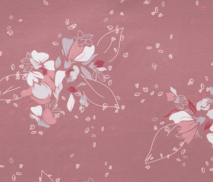 Detailaufnahme von rosafarbener Jersey-Bettwäsche in Normalgröße mit Blumenmuster.