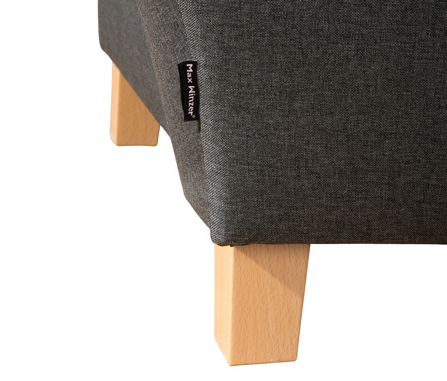 Detailaufnahme der grauen Recamiere »Saturn« mit Stauraum und Holzfüßen.