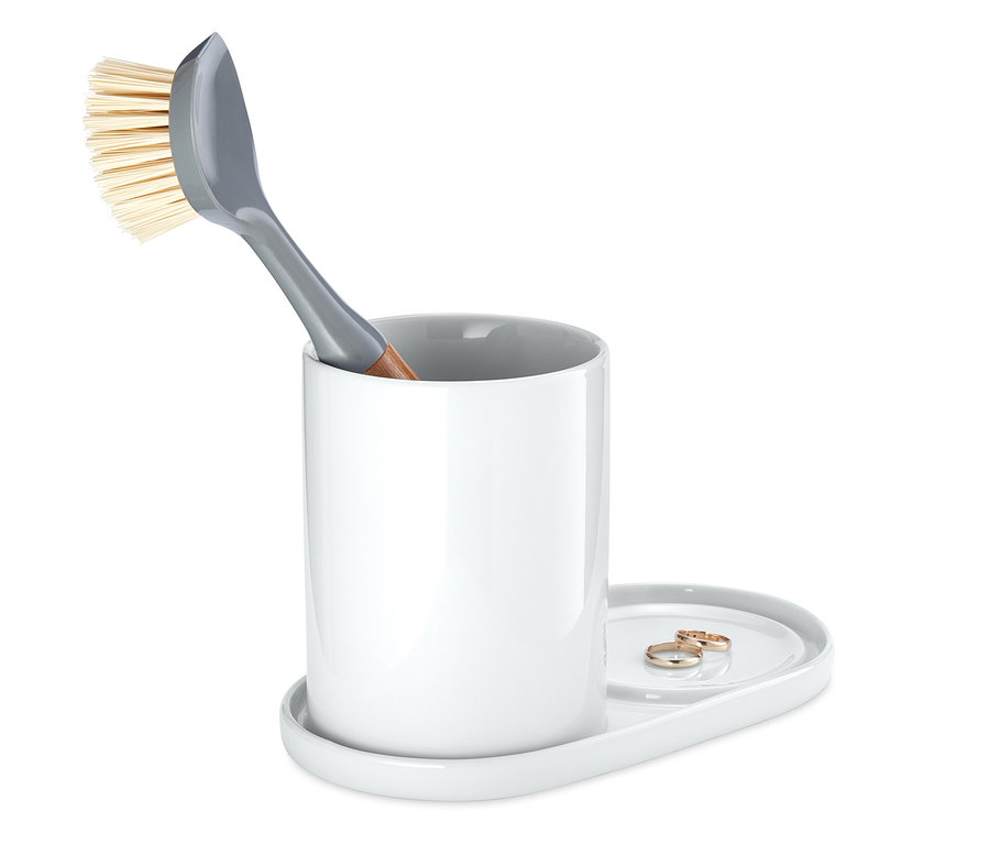 Graue Spülbürste in weißem Spülutensilien-Ständer.