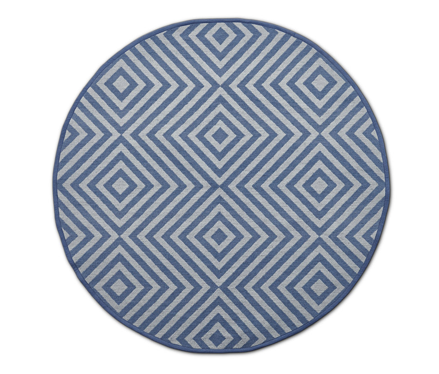 Detailansicht eines runden Outdoor-Wende-Teppichs mit geometrischem Muster.