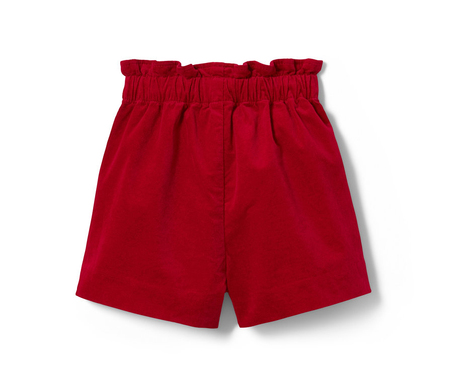 Rote Kleinkinder-Samtshorts auf weißem Hintergrund.