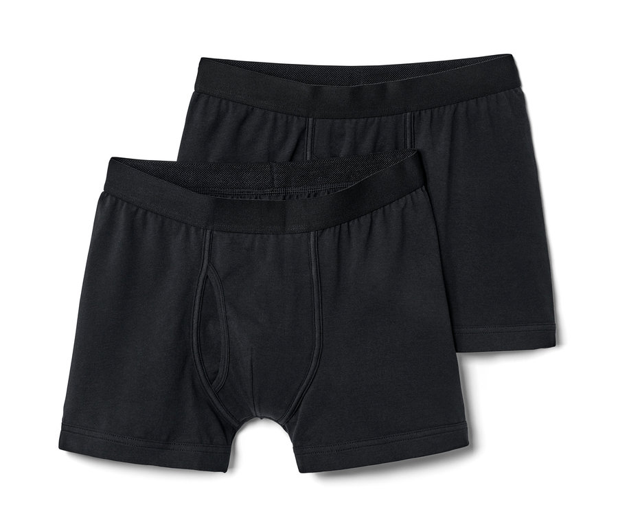 Zwei schwarze Slipboxer mit Eingriff liegen übereinander.