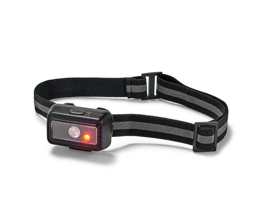 Nahaufnahme einer kompakten Stirnlampe mit schwarzem, elastischem Band und leuchtenden LED-Lichtern.