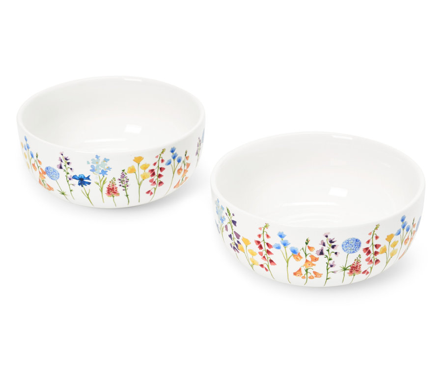 Zwei weiße Schüsseln mit Blumenmuster.