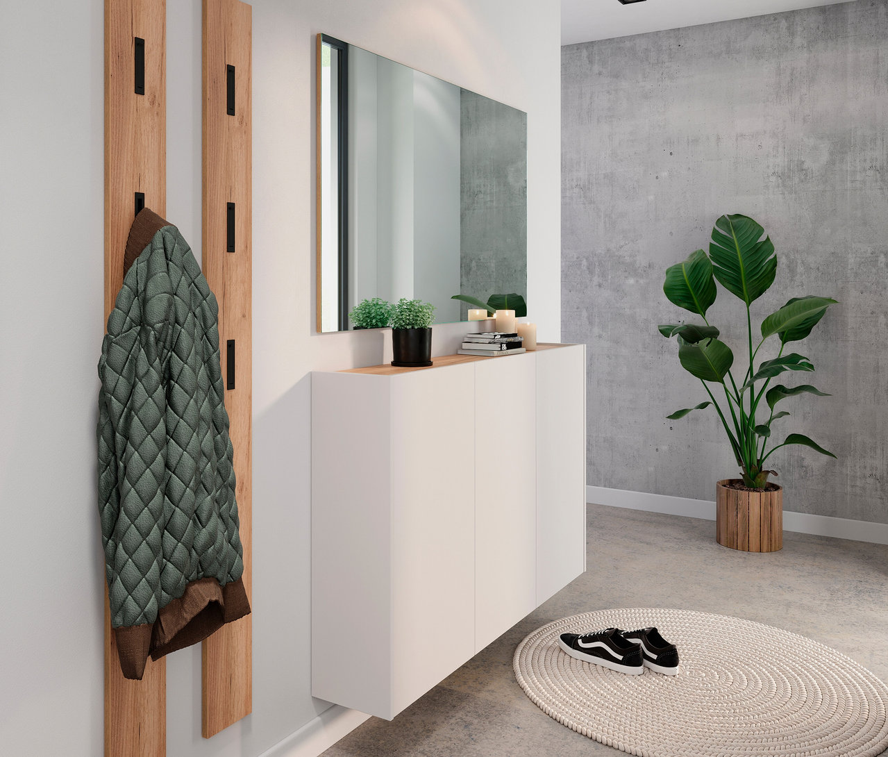 Eine grüne Jacke hängt an einer hölzernen Garderobe. Ein Spiegel hängt über einem weißen Schrank. Eine Zimmerpflanze steht in der Ecke.