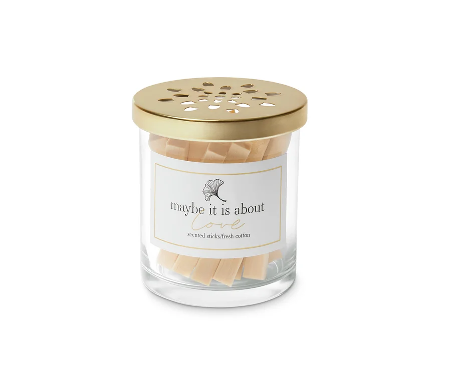 Raumduft-Sticks Baumwollfelder in einem durchsichtigen Glas mit goldenem Deckel.
