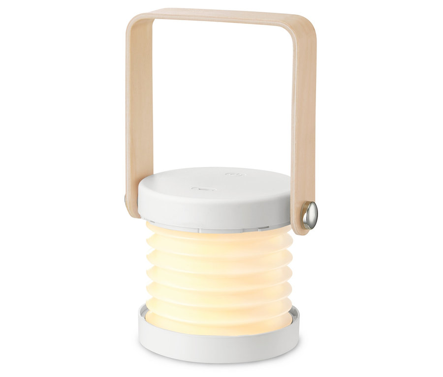 Eine faltbare LED-Leuchte leuchtet vor einem weißen Hintergrund.