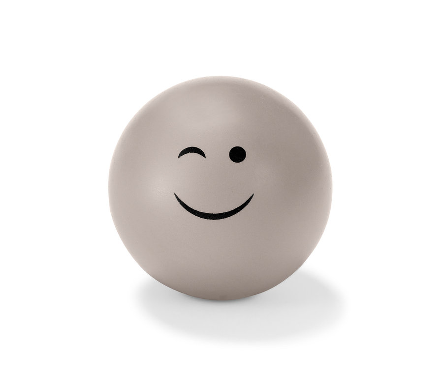 Grauer Antistressball mit zwinkerndem Gesicht.
