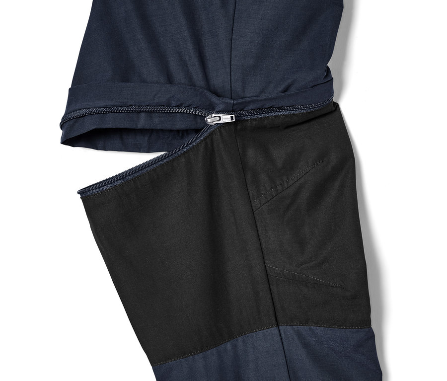 Detail einer blauen 2-in-1-Funktionshose mit Reißverschluss.