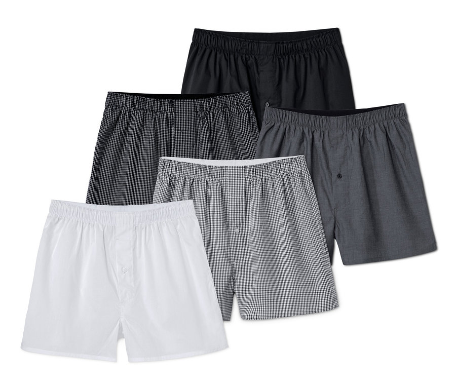 Fünf Web-Boxershorts in Schwarz-, Grau- und Weisstönen.