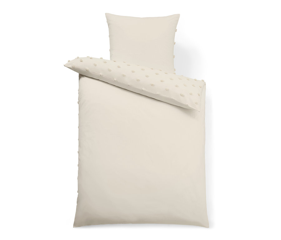 Beige Premium-Baumwoll-Bettwäsche: Bettbezug und Kissen mit Zierbäuschen.