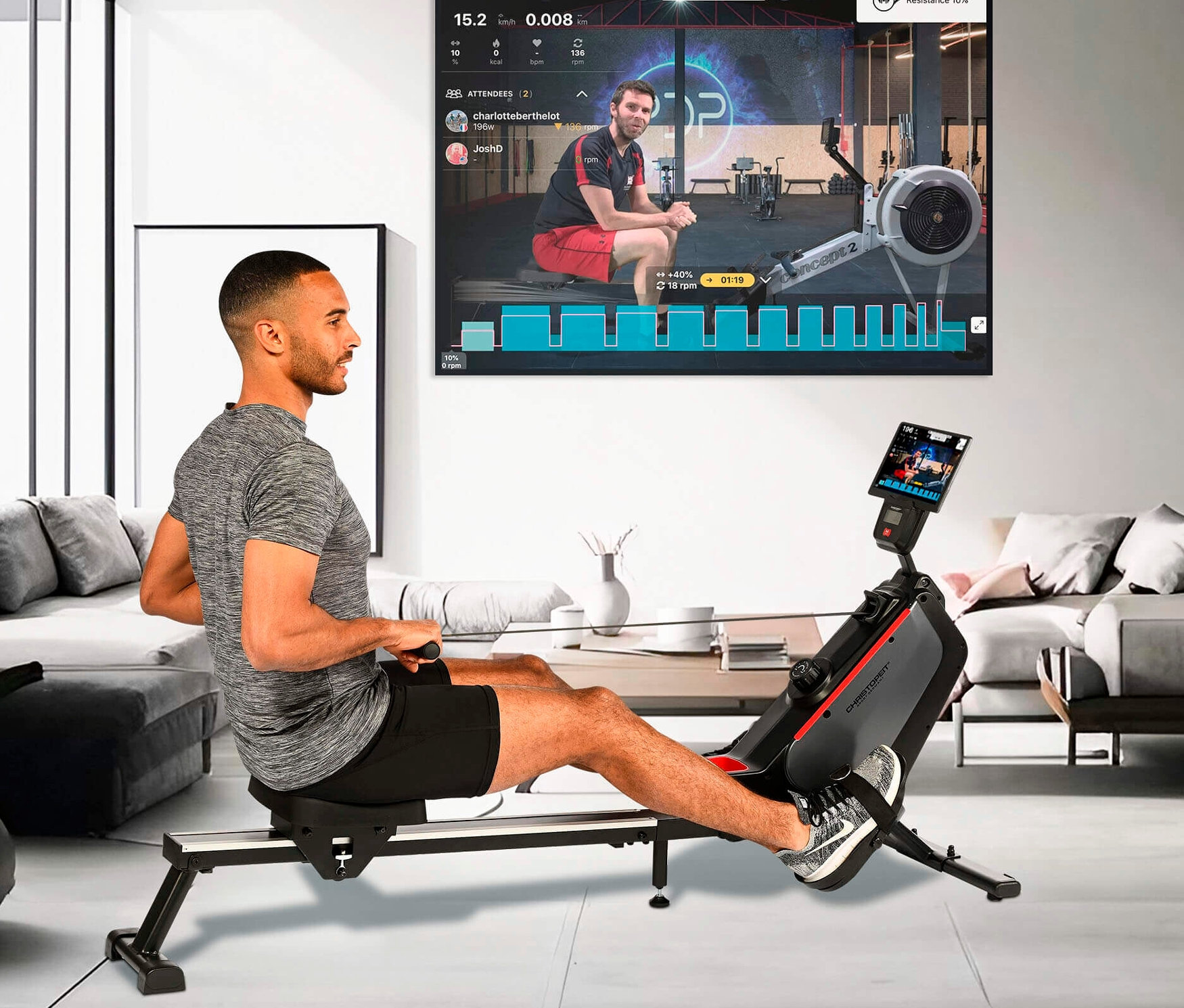 Mann trainiert auf dem Rudergerät RW 1000 vor einem Bildschirm mit einer Online-Lektion.